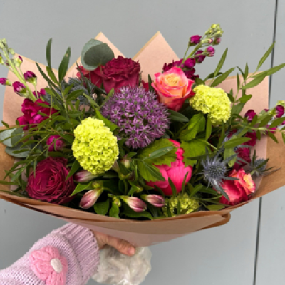 Luxurious Jewel boutique - Florist choice of warm summer gems with a vibrant pop of purples, pinks and orange tones.