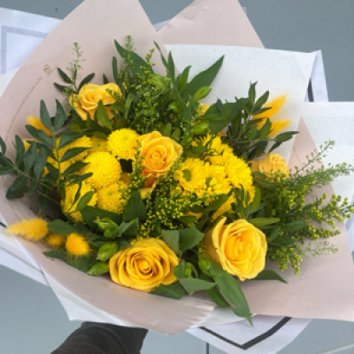 Fields of gold - A mix of warm sunny yellows and lush green foliage wrapped in eco friendly packaging.