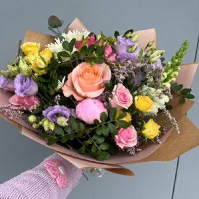 Florist choice of seasonal pastels tones - You may find Florals in Lemons, lilacs, pinks, peach and creams in this bouquet