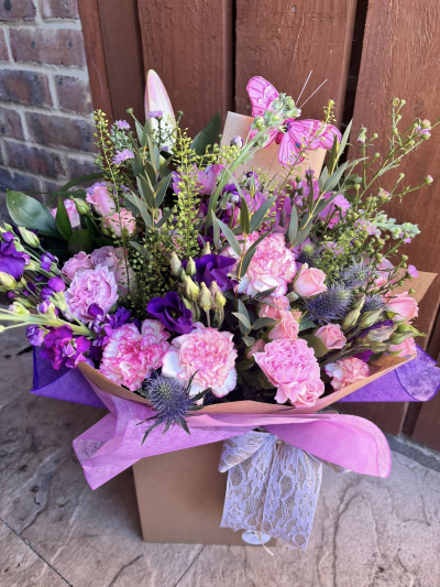 Dreamy Delight - A charming and whimsical arrangement in soft pink and vibrant purple tones, beautifully presented in a stylish gift box and finished with a delicate butterfly accent. Designed to bring joy, warmth, and a touch of enchantment, this bouquet combines elegant textures with graceful seasonal details for a truly memorable gift.

Perfect for birthdays, celebrations, thank-you gifts, new arrivals, or simply brightening someone's day, this delightful design radiates beauty, kindness, and heartfelt sentiment.