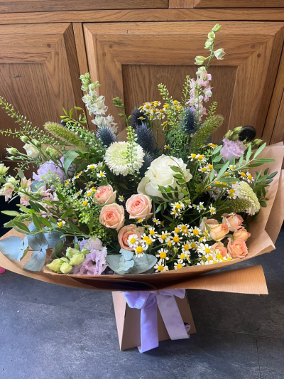 Country garden pastels - A selection of seasonal country garden style blooms in a pastel palette put together in a loose style for a natural soft finish. Wrapped in kraft paper and biodegradable cellophane aqua bubble for freshness and an eco friendly design.